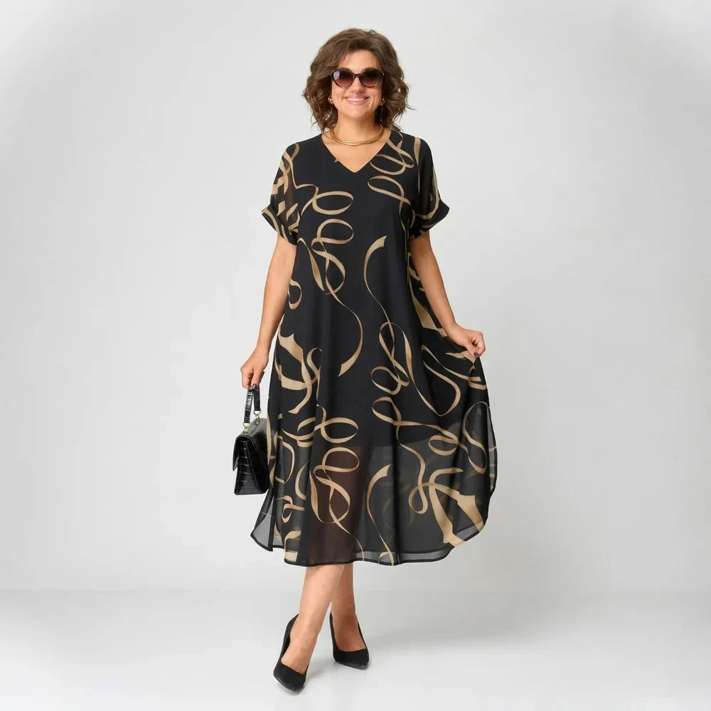 Elea - Vestido con volante y motivo dorado