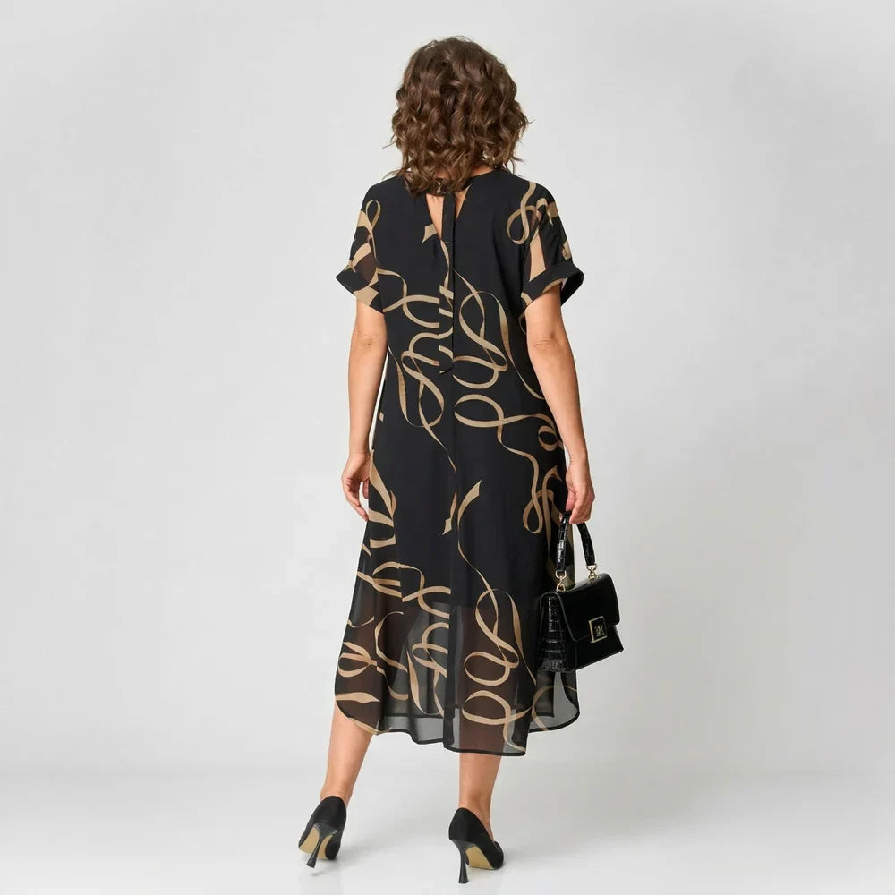 Elea - Vestido con volante y motivo dorado