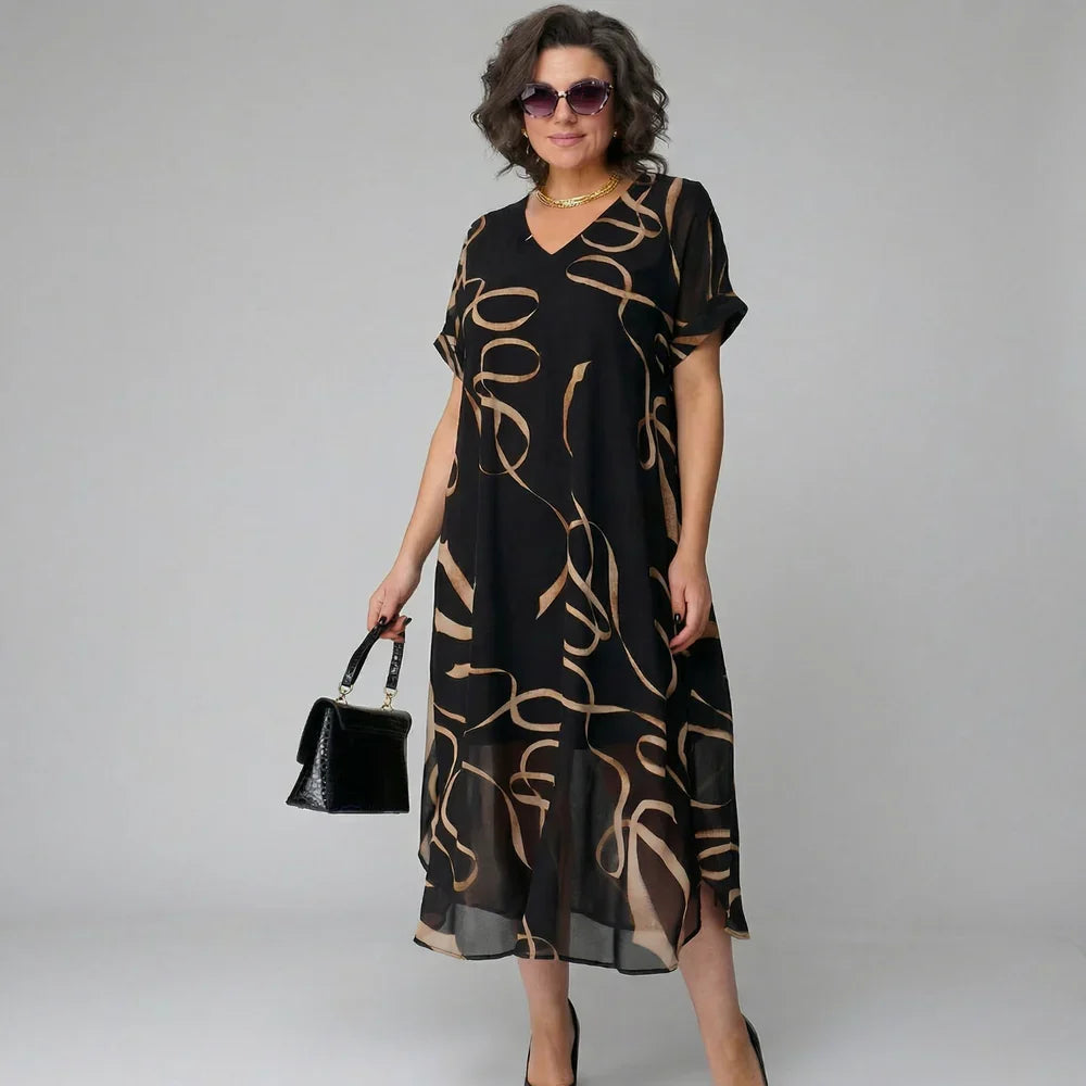 Elea - Vestido con volante y motivo dorado