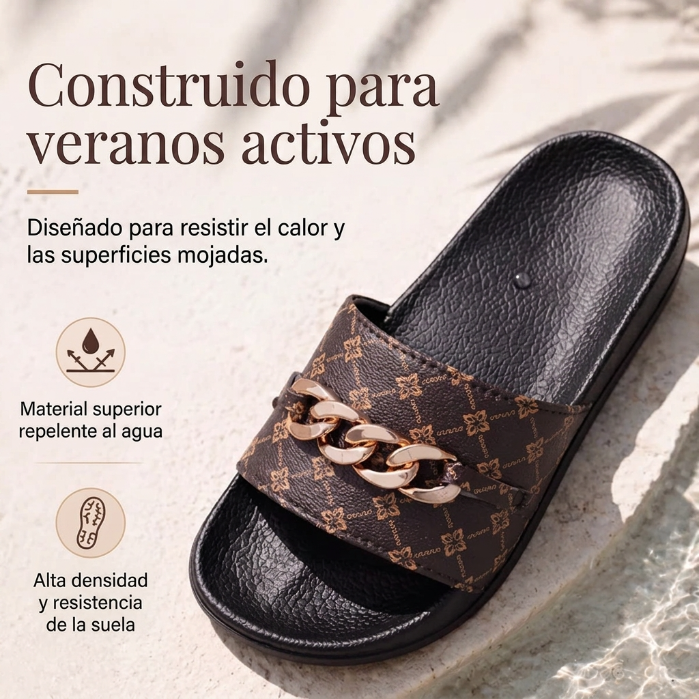 Elena - Sandalias ergonómicas con motivo monograma y adorno de cadena dorada