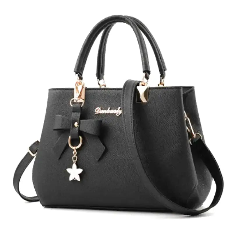 EUTERPE - Bolso espacioso con bandolera en cuero granulado - Negro - CARMEN VELVET