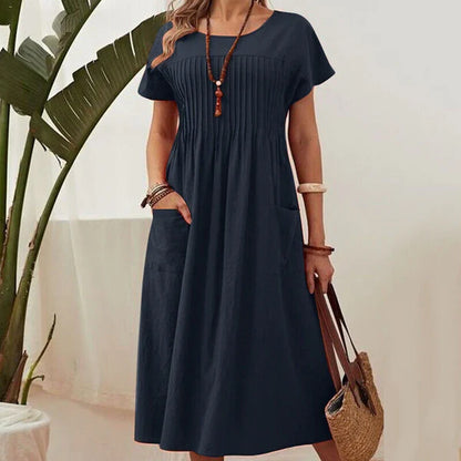 Emma - Vestido de textura plisada con mangas cortas y bolsillos